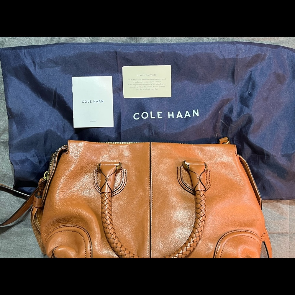 Brand new Coke Haan bag with crossbody strap and braided handles.